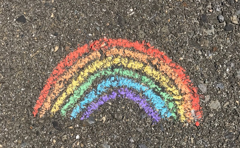 Rainbow drawn in sidewalk chalk