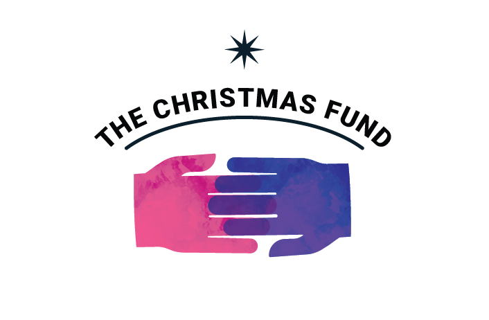 Image of a pink a purple hand touching each other, with text that says 'The Christmas Fund.'